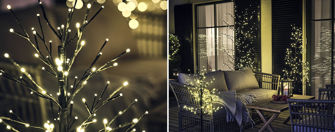 Pomi iluminați în aer liber pe o terasă din lemn cu set de lounge