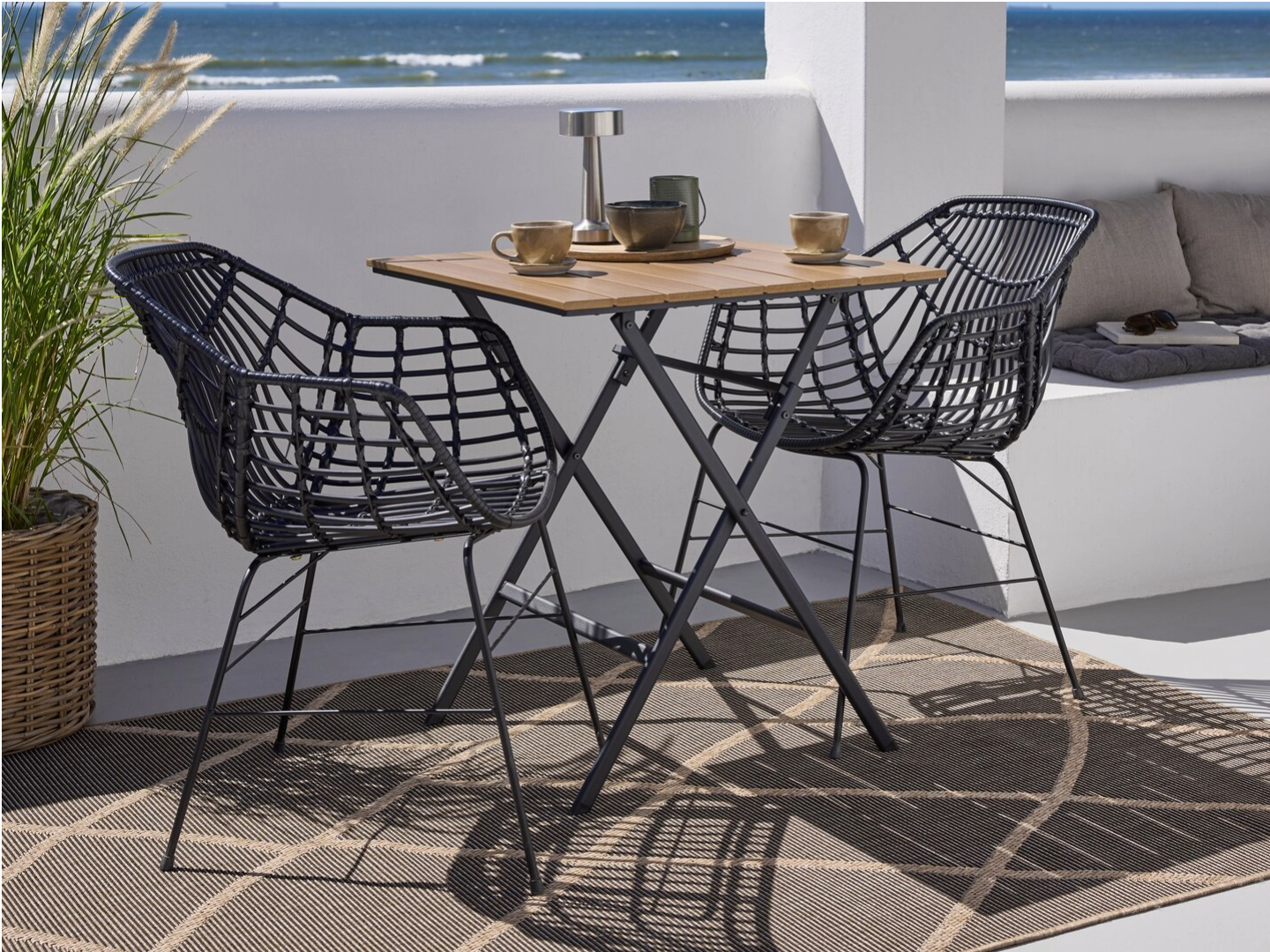SANDVIKA coffee table and ILDERHUSE garden chair