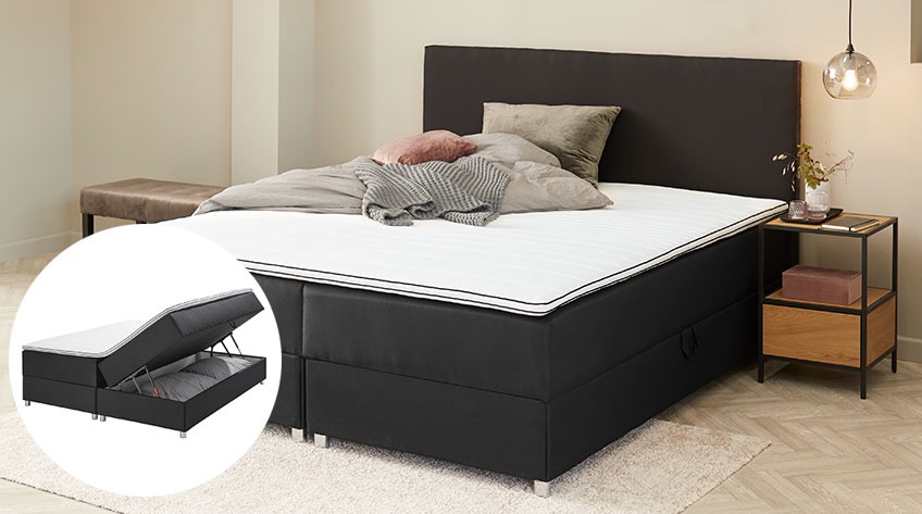 Continental bed with a compartment at the bed base for extra duvets and pillows