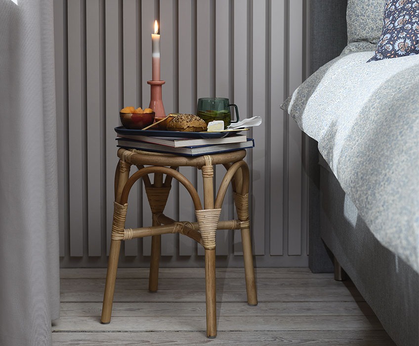 JUNGHOLM stool, THRISTAN candlestick and ANDERS glass mug Stool with books and breakfast in bedroom