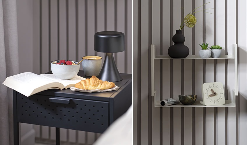 VIRUM bedside table, LAUKE table lamp, ASSENS wall shelf and EDDIE clock Black bedside table with book and breakfast and metal wall shelf