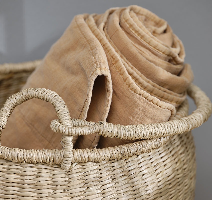 VALMUE orange blanket and BRAGE basket Wicker basket with orange quilted blanket