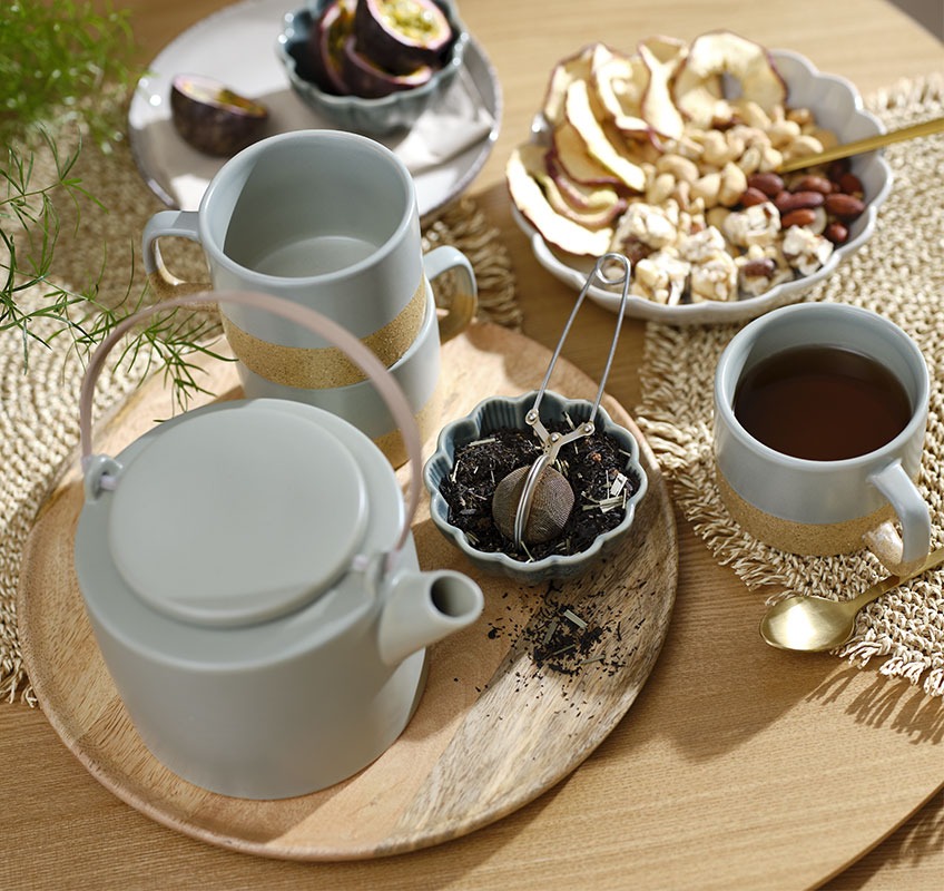 SIMON green bowl, GAUTE teapot, HALFDAN mugs and GERNER tray Wooden tray with green teapot and mugs and small bowls with snacks and tea