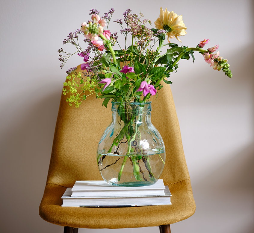 GERD vase on JONSTRUP dining chair Glass vase on a dining chair