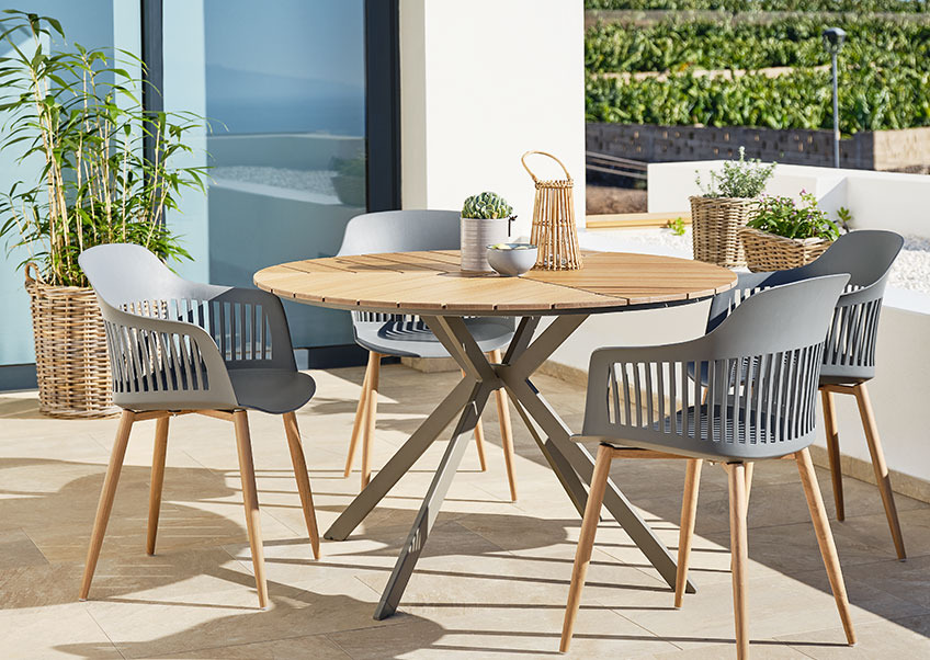 Round garden table with grey garden chairs 