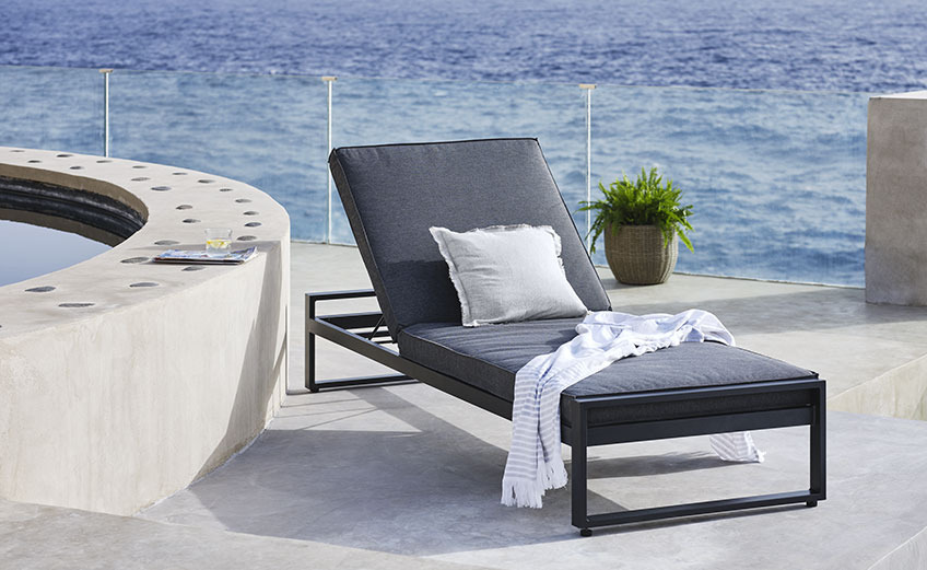 Sun lounger on a balcony by the ocean